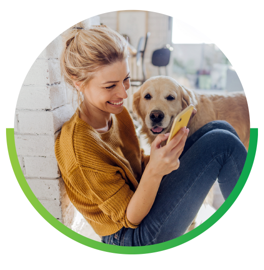 Woman with dog looking at phone